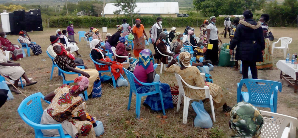 Distributing food relief to project beneficiaries