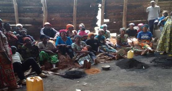 Members of Abahujumugambi Kilimbi Cooperative in Nyamasheke District during hands-on training on producing charcoal from biodegradable waste, an eco-friendly alternative to wood-based fuel.