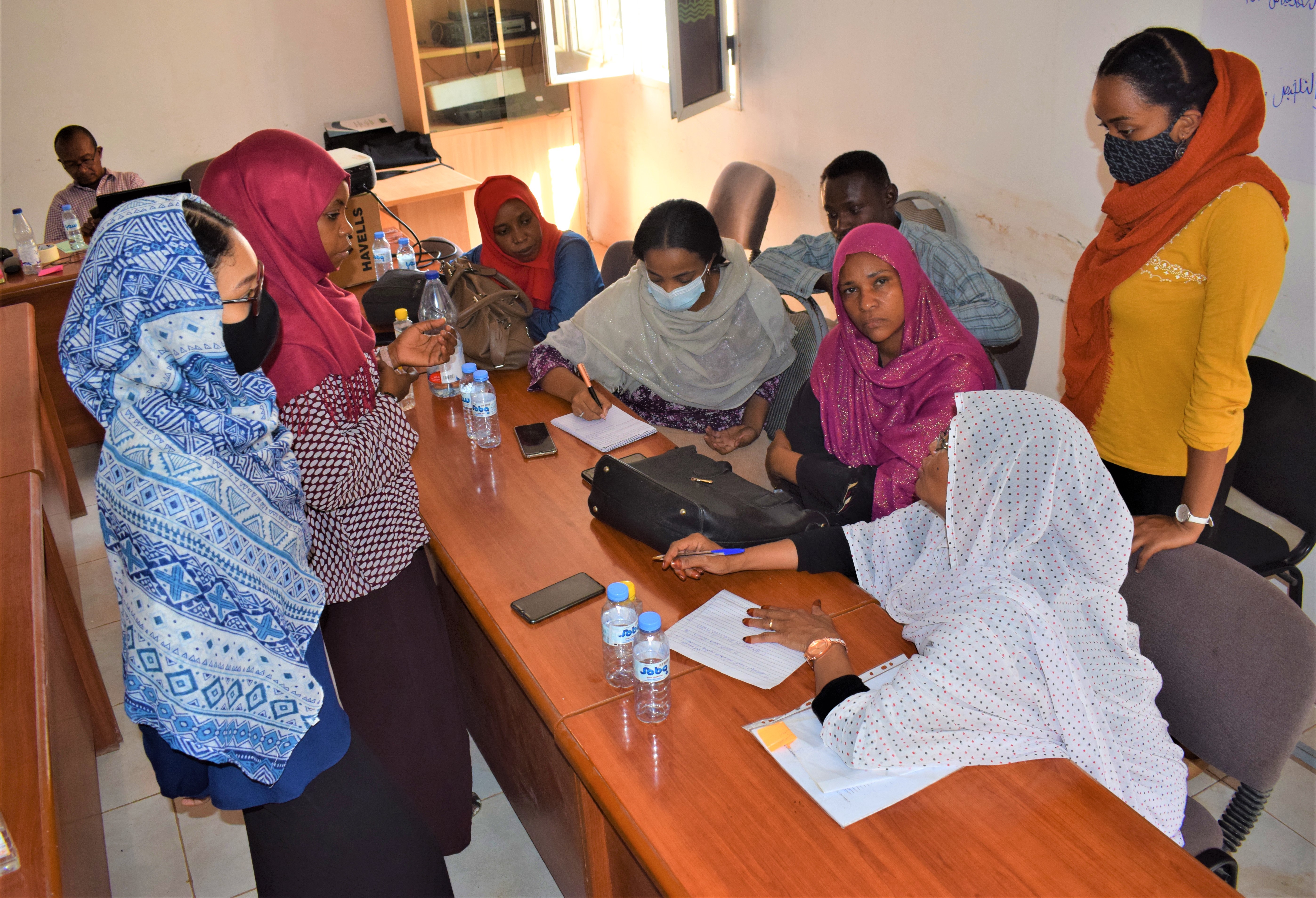 Women as a target group participate in a focused group discussion during the training workshop